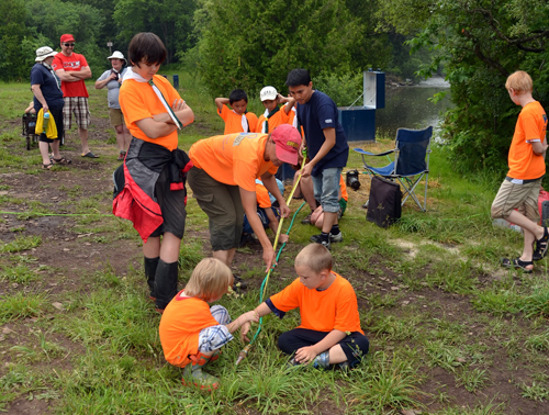 Scouts pump water from the Eramosa River.