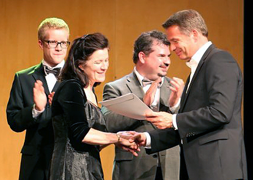 Marta McCarthy accepts an award in Mosbach, Germany.