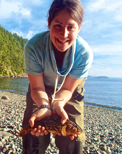 Justine Ammendolia, holding a Whitespotted greenling caught on Waldron Island in Washington State, calls herself a “hopeful marine biologist.” 